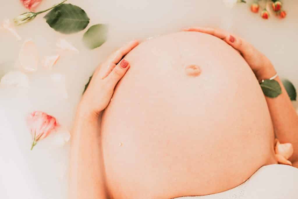Pregnant belly with flowers